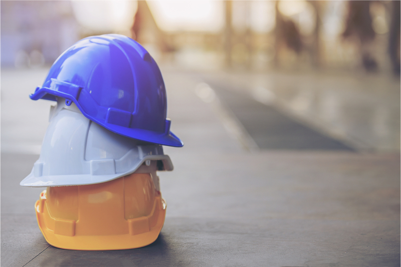 hard hats for safety on a concrete construction site